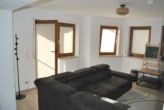 Wohnzimmer mit Zugang zur Terrasse